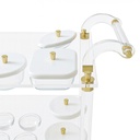 Acrylic trolley-Acrylic serving cart with three shelves and gold accents, white lidded plates.