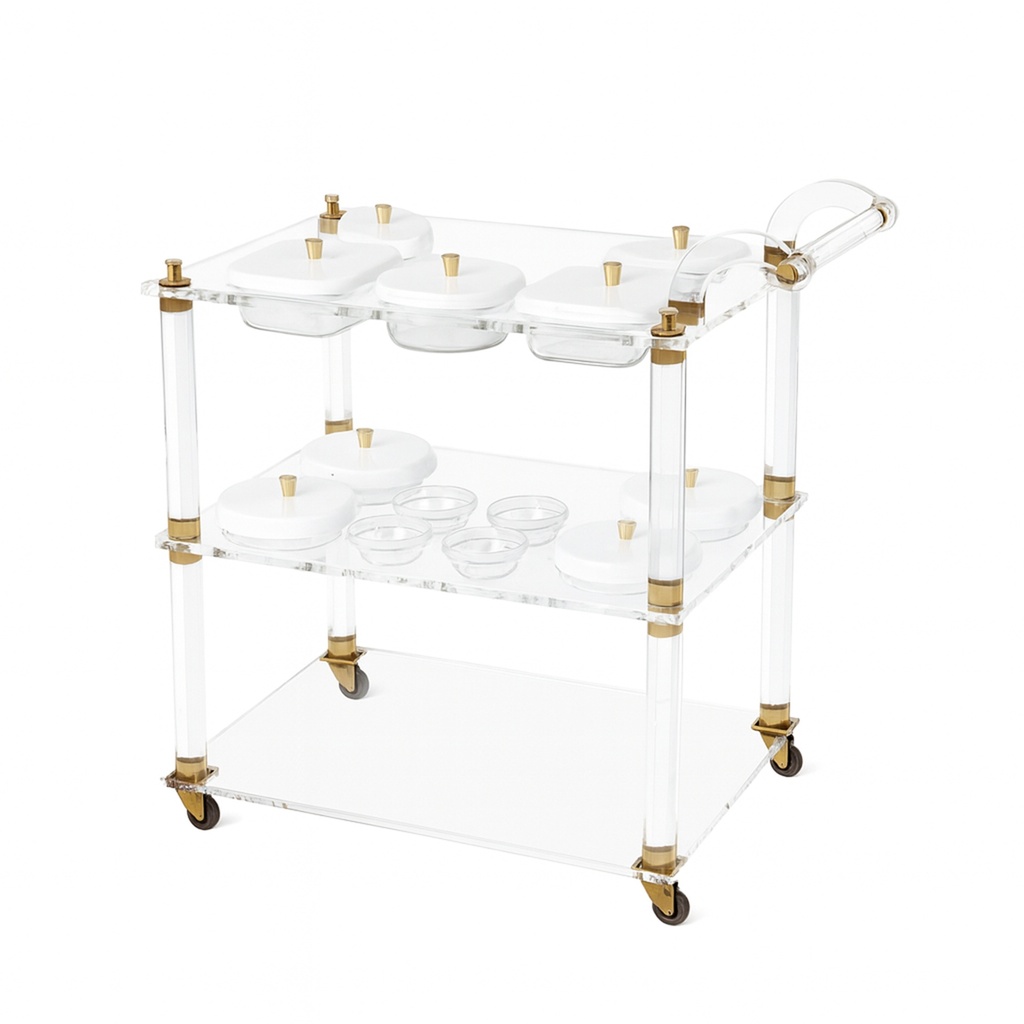 Acrylic trolley-Acrylic serving cart with three shelves and gold accents, white lidded plates.
