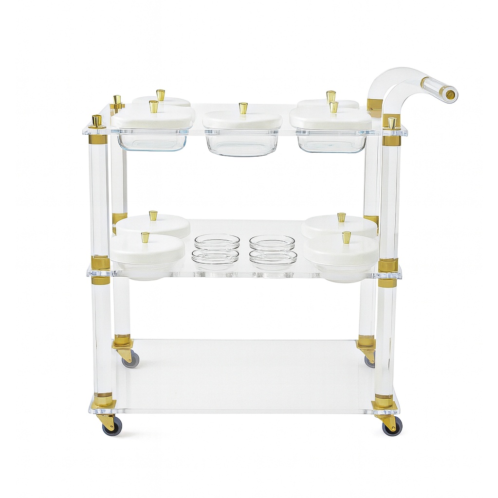 Acrylic trolley-Acrylic serving cart with three shelves and gold accents, white lidded plates.