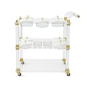 Acrylic trolley-Acrylic serving cart with three shelves and gold accents, white lidded plates.